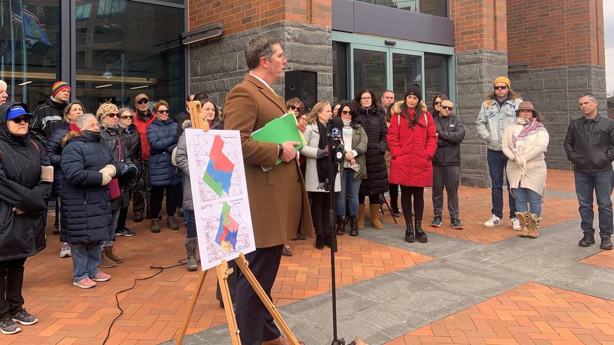 Attorney Brian Flynn and supporters of a group opposing the Central Bucks School District's proposed plan on changing the district's voting regions for the election of board members filed a petition in Downingtown District Court on Friday.