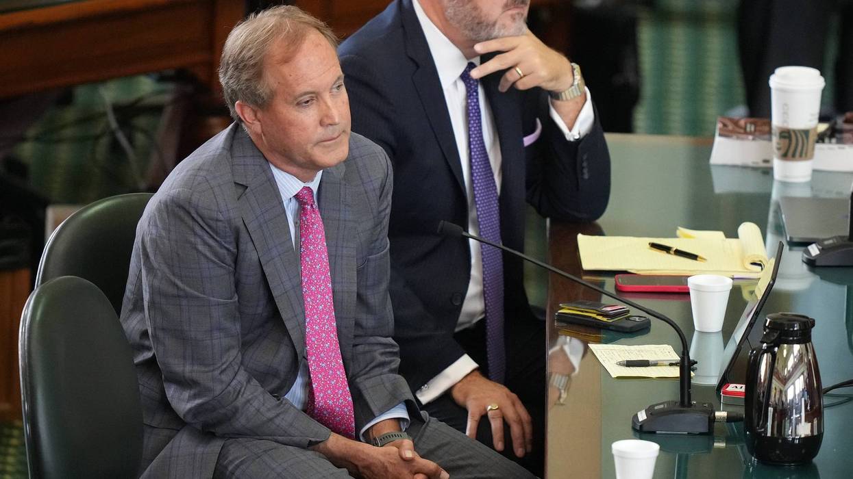 Attorney General Ken Paxton, left, and his attorney Mitch Little listen to closing arguments at his impeachment trial at the Capitol on Friday, Sept. 15, 2023.