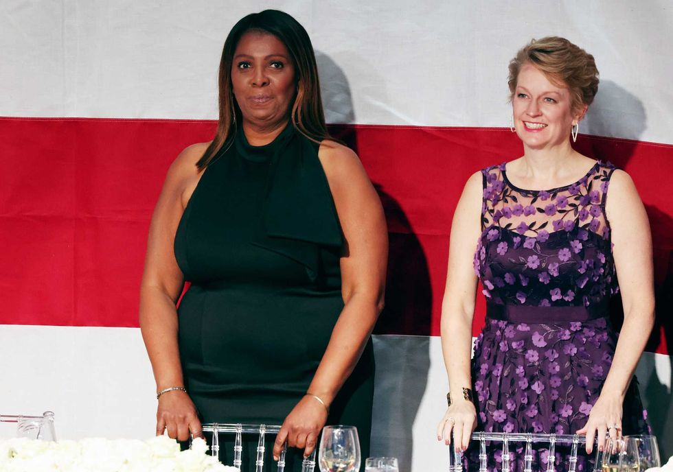 Attorney General of New York Letitia James (L) stands during the annual Alfred E. Smith Foundation Dinner at the New York Hilton Midtown on October 17, 2024