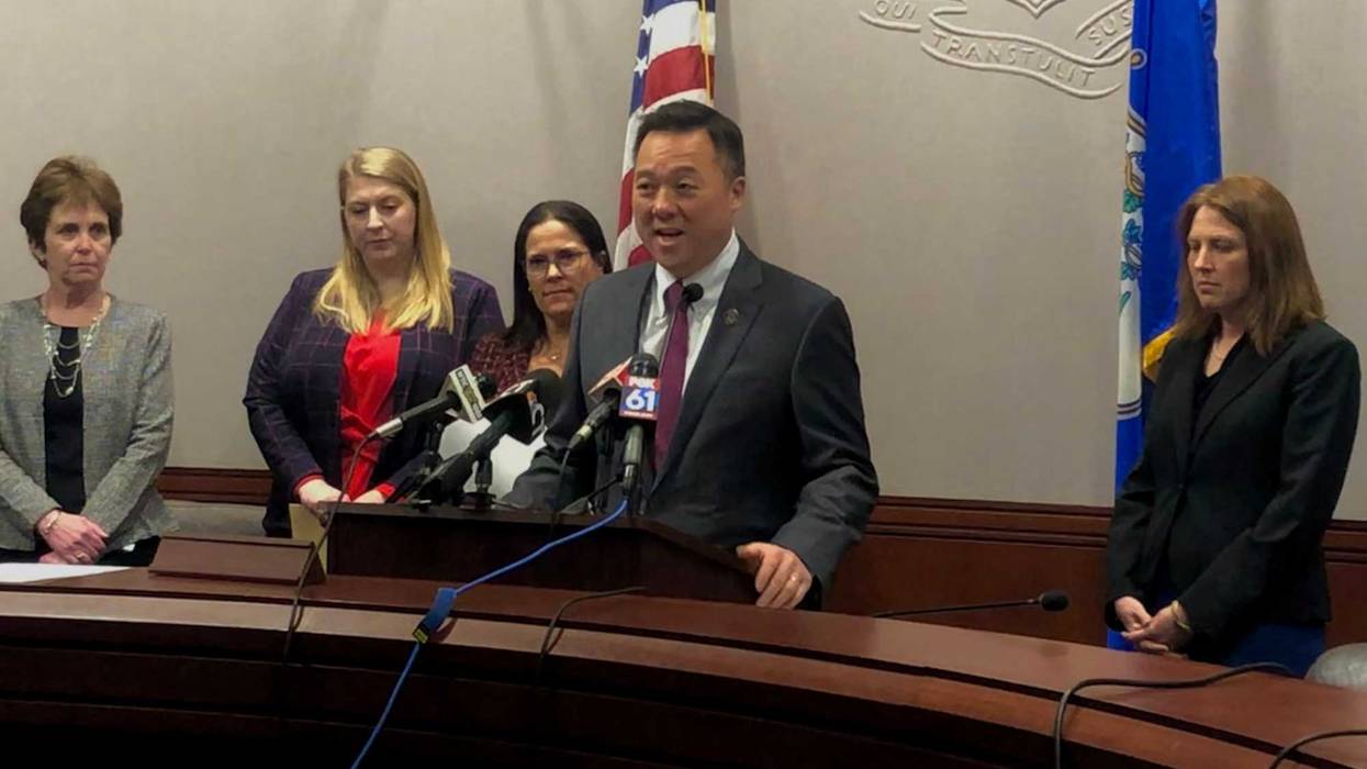 Attorney General William Tong stands at the podium at the State Capitol.