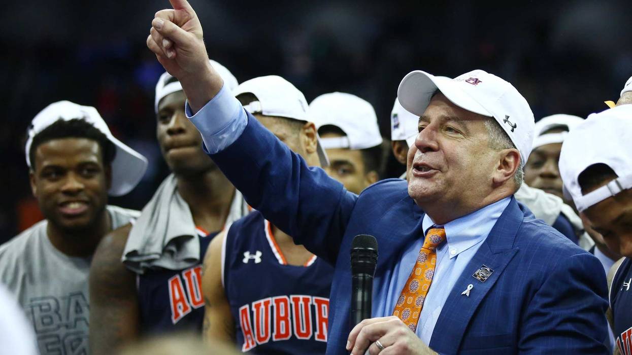 Auburn coach Bruce Pearl and his Tigers celebrate after advancing to the Final Four.