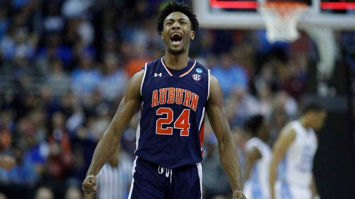 Auburn's Anfernee McLemore celebrates at the end of the first half of a men's NCAA tournament college basketball Midwest Regional semifinal game against North Carolina Friday, March 29, 2019, in Kansas City, Mo.