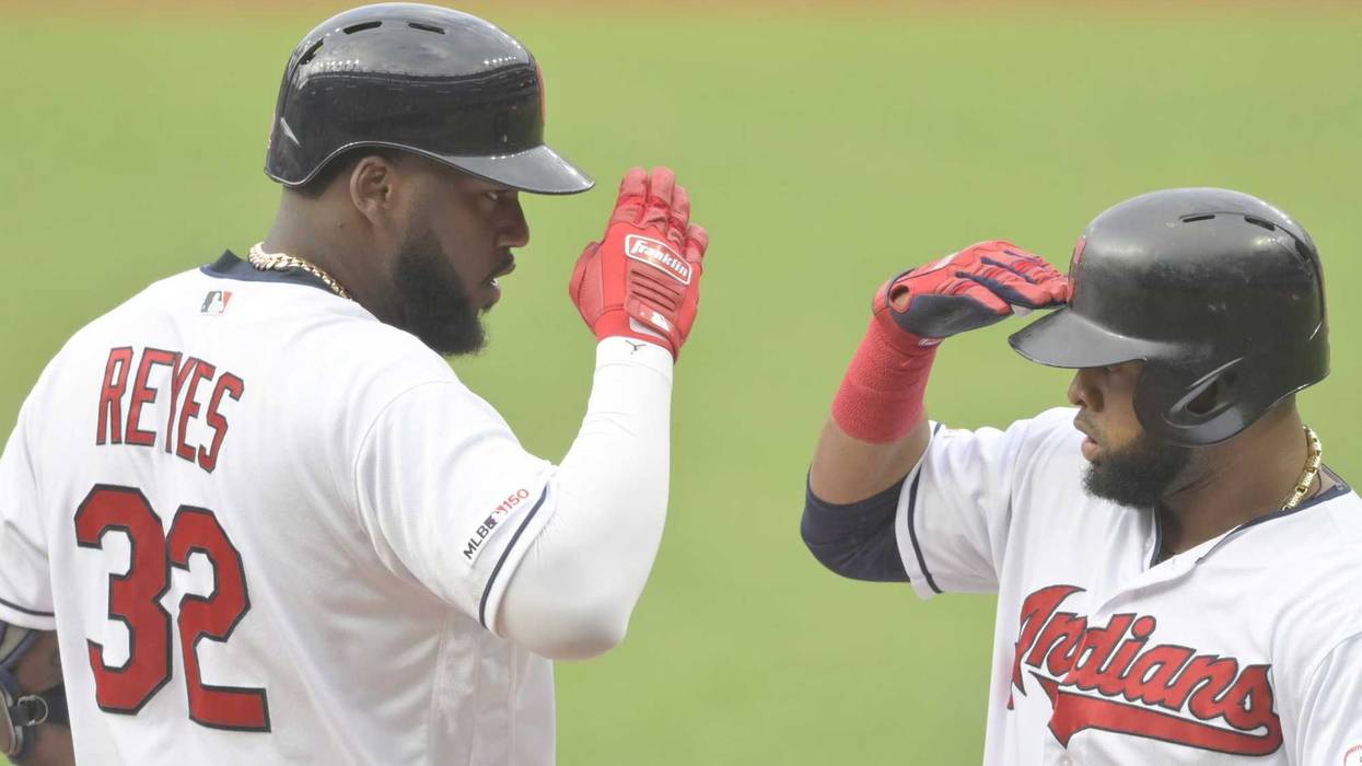 Aug 12, 2019; Cleveland, OH, USA; Cleveland Indians designated hitter Franmil Reyes (32) celebrates his two-run home run with first baseman Carlos Santana (41) in the first inning against the Boston Red Sox at Progressive Field. Mandatory Credit: David Ri
