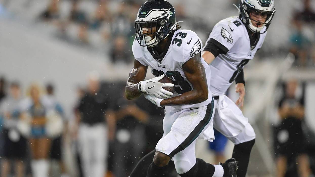 Aug 15, 2019; Jacksonville, FL, USA; Philadelphia Eagles quarterback Clayton Thorson (8) hands the ball off to running back Josh Adams (33) for a touchdown against the Jacksonville Jaguars during the third quarter at TIAA Bank Field.