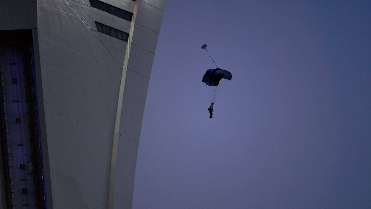 Aug 18, 2018; Montreal, Quebec, CAN; A base jumper leaps from the OlyAug 18, 2018; Montrempic Stadium's tower during the first half of the game between the Chicago Fire and the Montreal Impact at Stade Saputo. Mandatory Credit: Eric Bolte-USA TODAY Sports