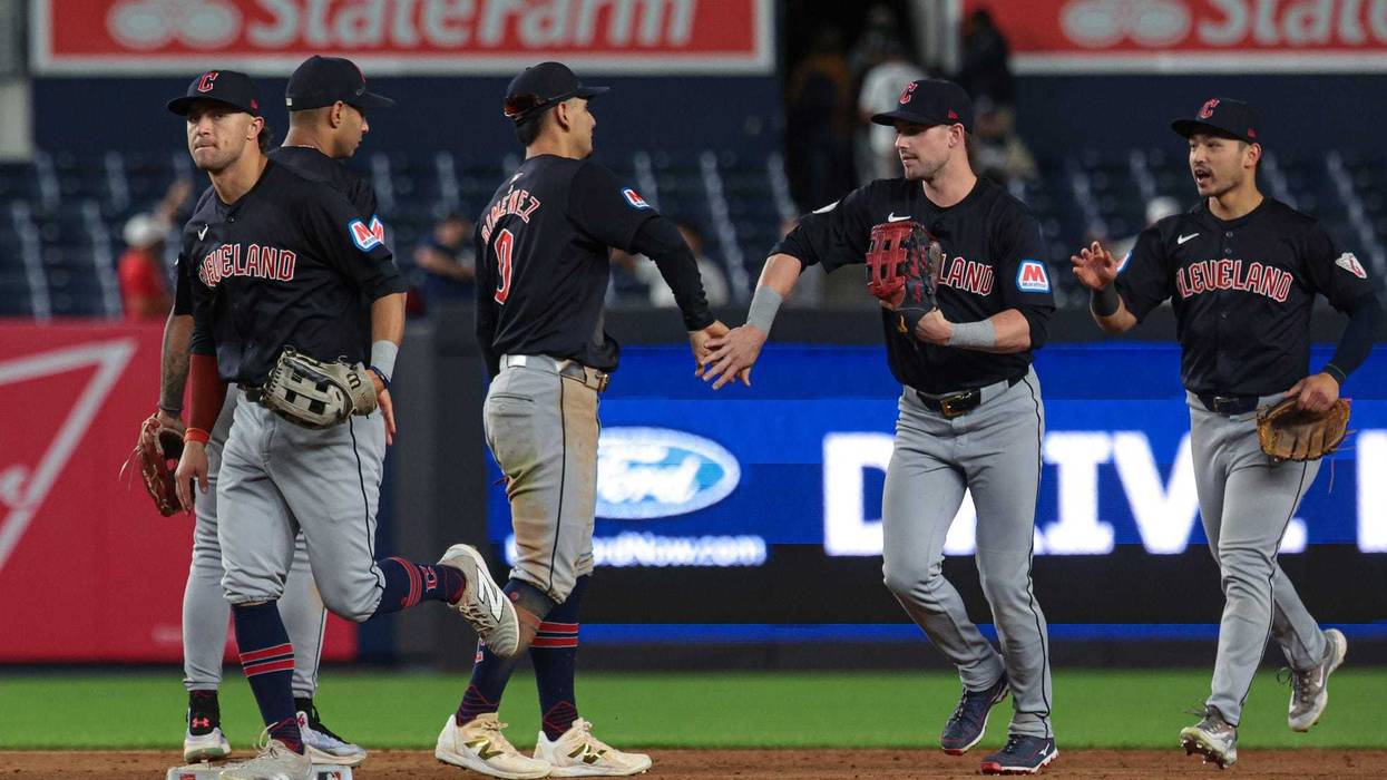 Aug 20, 2024; Bronx, New York, USA; Cleveland Guardians second baseman Andres Gimenez (0) celebrates with teammates after defeating the New York Yankees in twelve innings at Yankee Stadium.