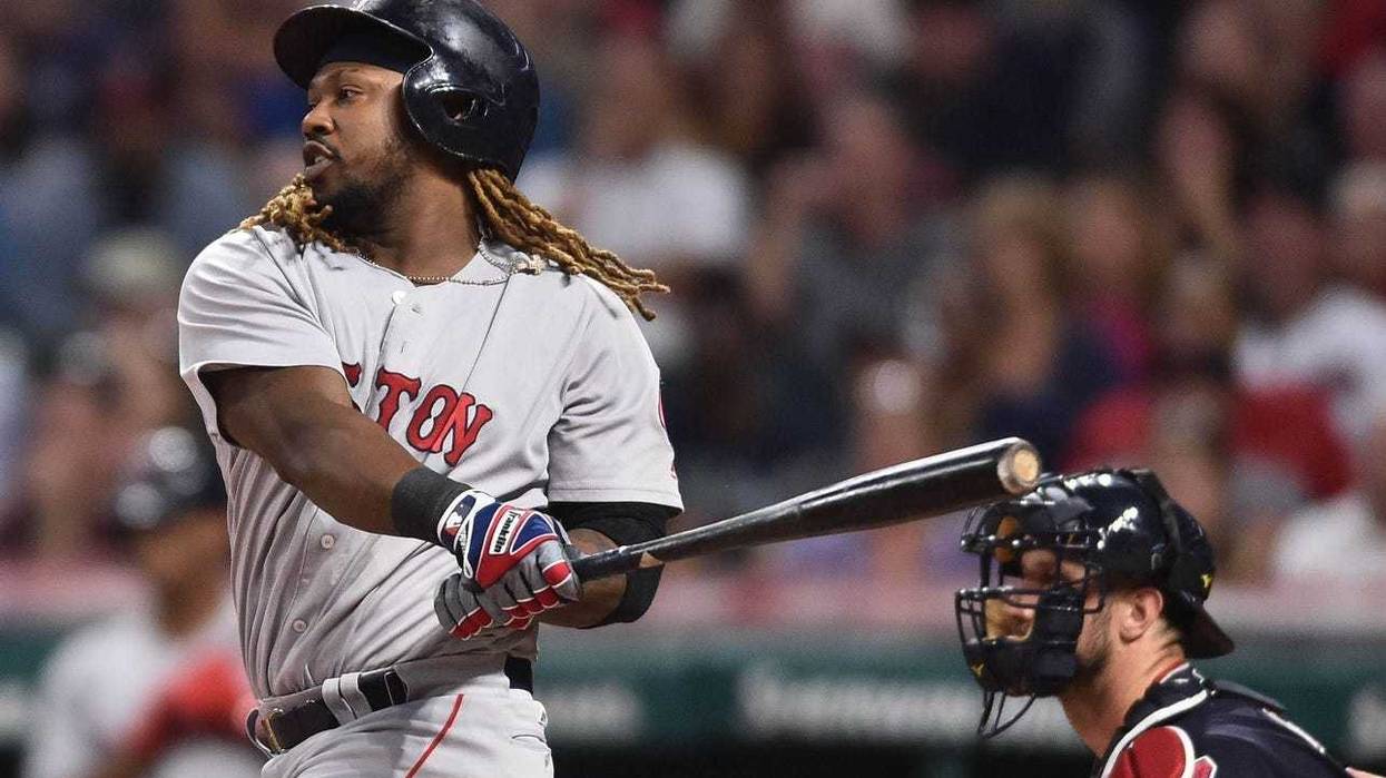 Aug 22, 2017; Cleveland, OH, USA; Boston Red Sox designated hitter Hanley Ramirez (13) hits an RBI single during the first inning against the Cleveland Indians at Progressive Field. Mandatory Credit: Ken Blaze-USA TODAY Sports