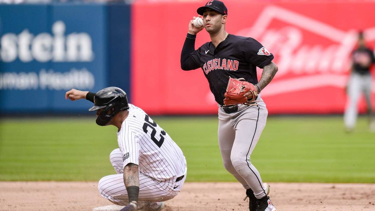 Aug 22, 2024; Bronx, New York, USA; Cleveland Guardians shortstop Brayan Rocchio (4) gets a force out at second base against New York Yankees second baseman Gleyber Torres (25) during the fifth inning at Yankee Stadium.