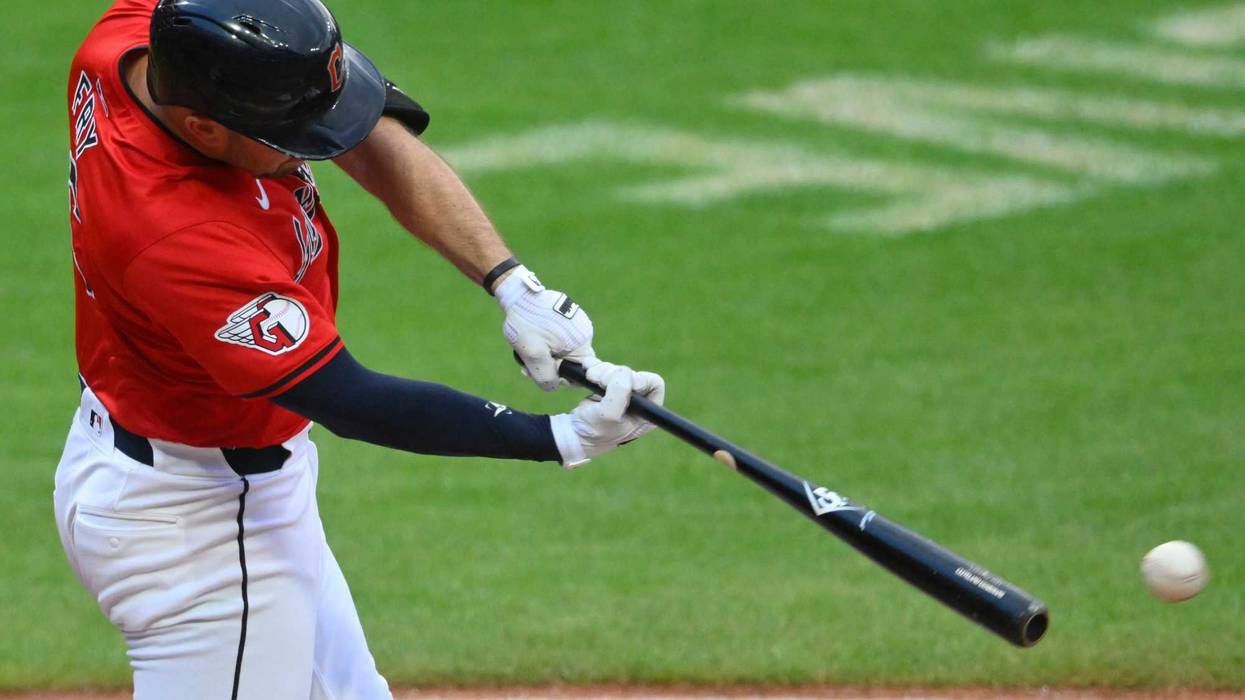 Aug 27, 2024; Cleveland, Ohio, USA; Cleveland Guardians catcher David Fry (6) singles in the second inning against the Kansas City Royals at Progressive Field.