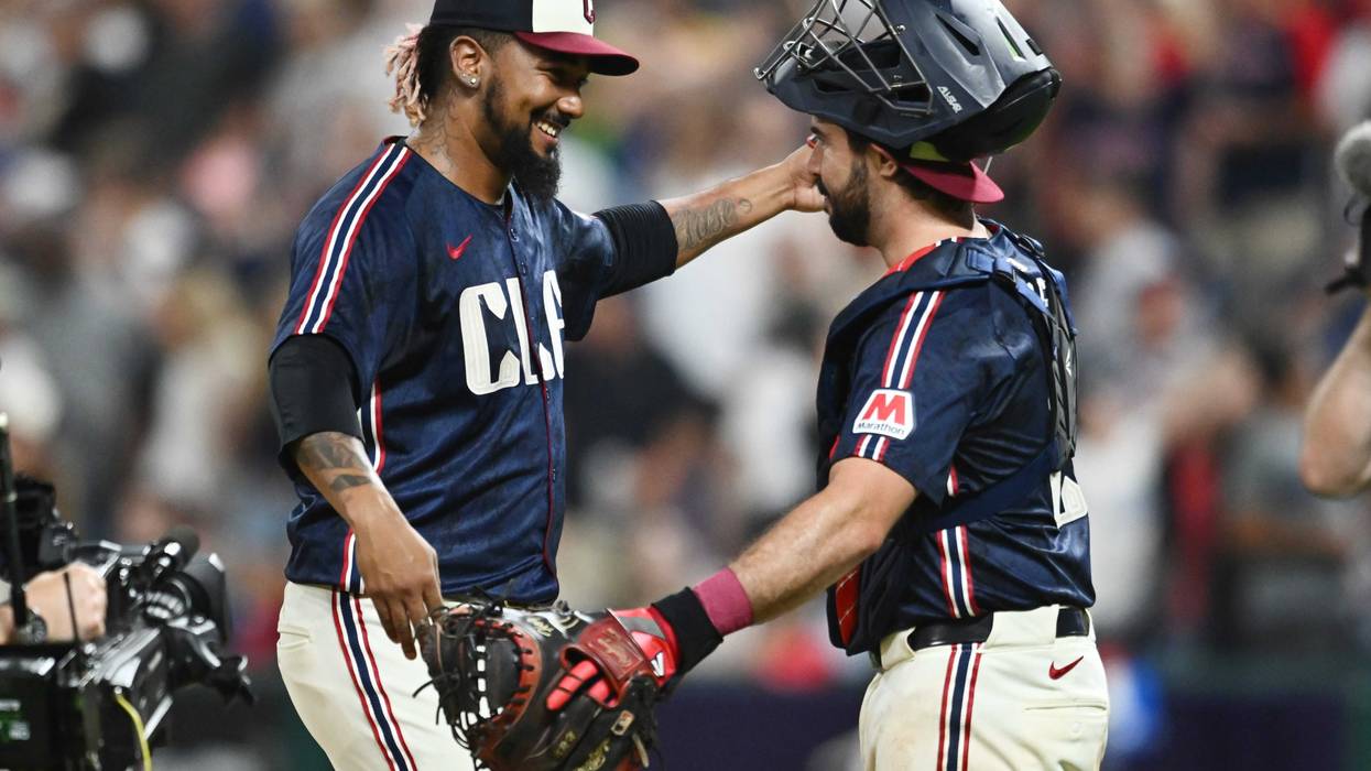 Aug 30, 2024; Cleveland, Ohio, USA; Cleveland Guardians relief pitcher Emmanuel Clase (48) celebrates with catcher Austin Hedges (27) after the Guardians beat the Pittsburgh Pirates at Progressive Field. Clase became the Guardians career saves leader in the game.