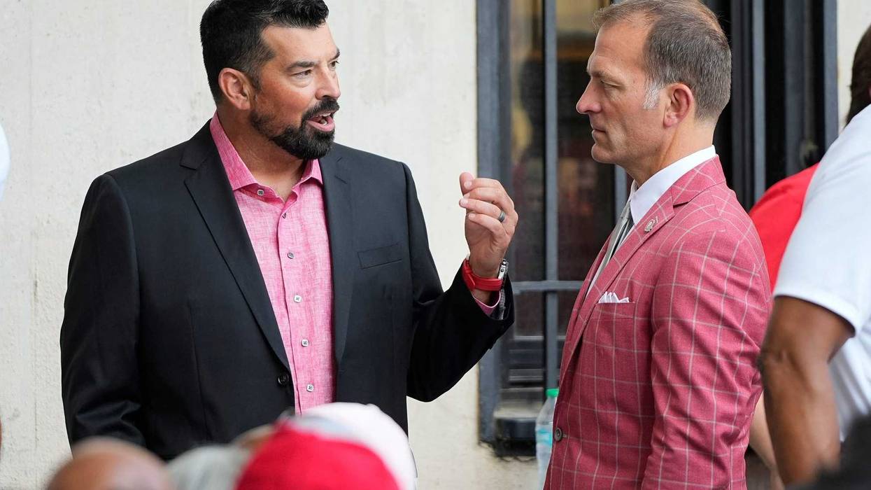 Aug 30, 2024; Columbus, OH, USA; Ohio State Buckeyes head coach Ryan Day and athletic director Ross Bjork attend the unveiling of a statue for former Buckeyes running back Archie Griffin outside Ohio Stadium.