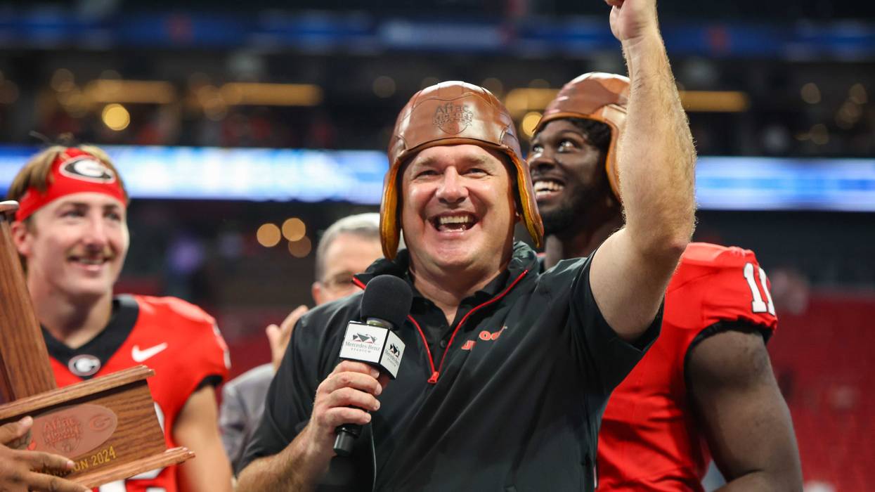 Aug 31, 2024; Atlanta, Georgia, USA; Georgia Bulldogs head coach Kirby Smart wears the old leather helmet after a victory over the Clemson Tigers at Mercedes-Benz Stadium. Mandatory Credit: Brett Davis-USA TODAY Sports