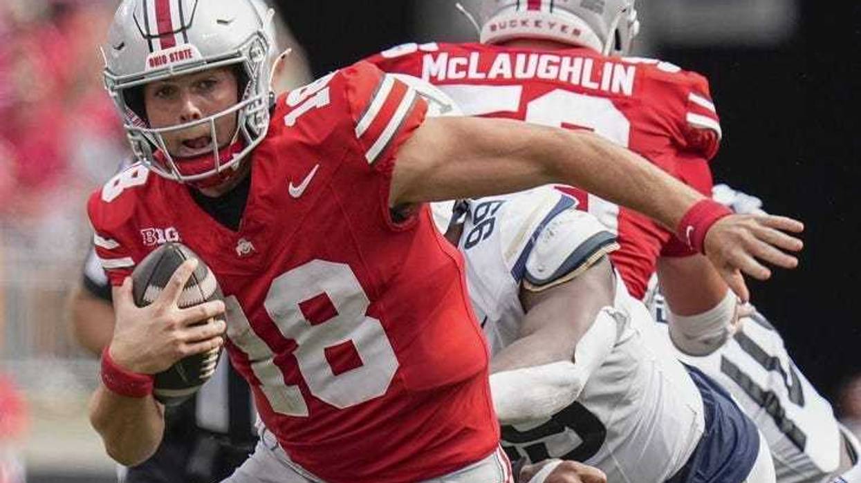 Aug 31, 2024; Columbus, OH, USA; Ohio State Buckeyes quarterback Will Howard (18) scrambles out of the pocket during the NCAA football game against the Akron Zips at Ohio Stadium. Ohio State won 52-6.