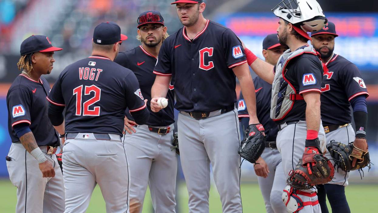 Aug 6, 2025; New York City, New York, USA; Cleveland Guardians manager Stephen Vogt (12) takes the ball from starting pitcher Gavin Williams (32) during a pitching change during the ninth inning against the New York Mets at Citi Field.