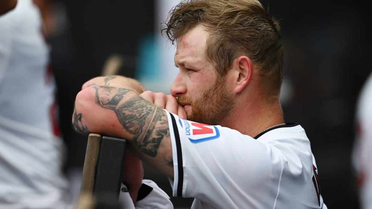 Aug 7, 2024; Cleveland, Ohio, USA; Cleveland Guardians starting pitcher Ben Lively (39) looks on from the dugout during the fifth inning against the Arizona Diamondbacks at Progressive Field.