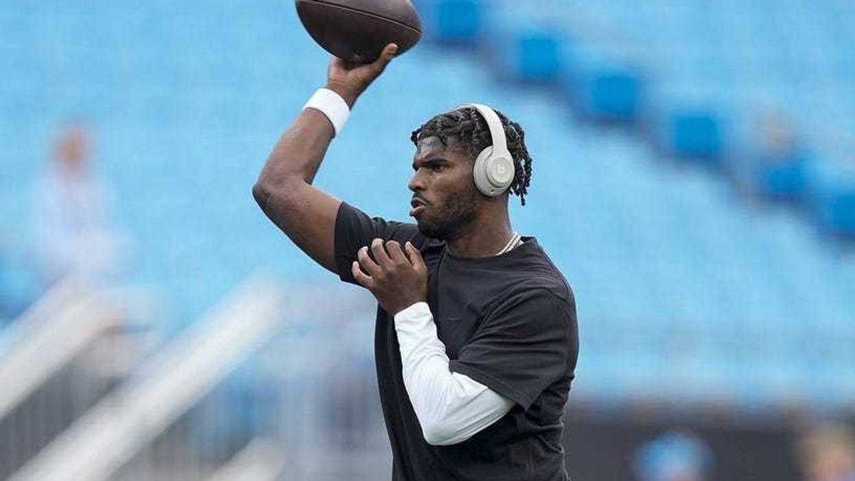 Aug 8, 2025; Charlotte, North Carolina, USA; Cleveland Browns quarterback Shedeur Sanders (12) throws the ball during pregame warm ups against the Carolina Panthers at Bank of America Stadium.