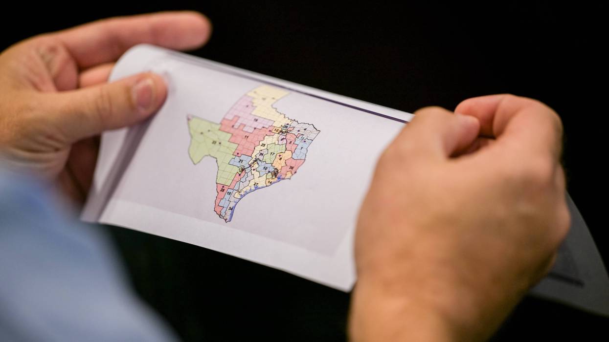 AUSTIN, TEXAS - AUGUST 07: A person views a map during a Senate Special Committee on Congressional Redistricting public testimony hearing on August 07, 2025 in Austin, Texas. The Senate Special Committee on Congressional Redistricting met to hear public testimony on Congressional plan C2308. Earlier this week, Texas Democratic lawmakers fled the state in an attempt to protest and deny quorum for votes on the proposed Republican redistricting plan, which would secure five additional GOP seats in the U.S. House. Gov. Greg Abbott has threatened to remove lawmakers who do not return and has asked the Texas Supreme Court to expel House Democratic leaders who fled the state. (Photo by Brandon Bell/Getty Images)