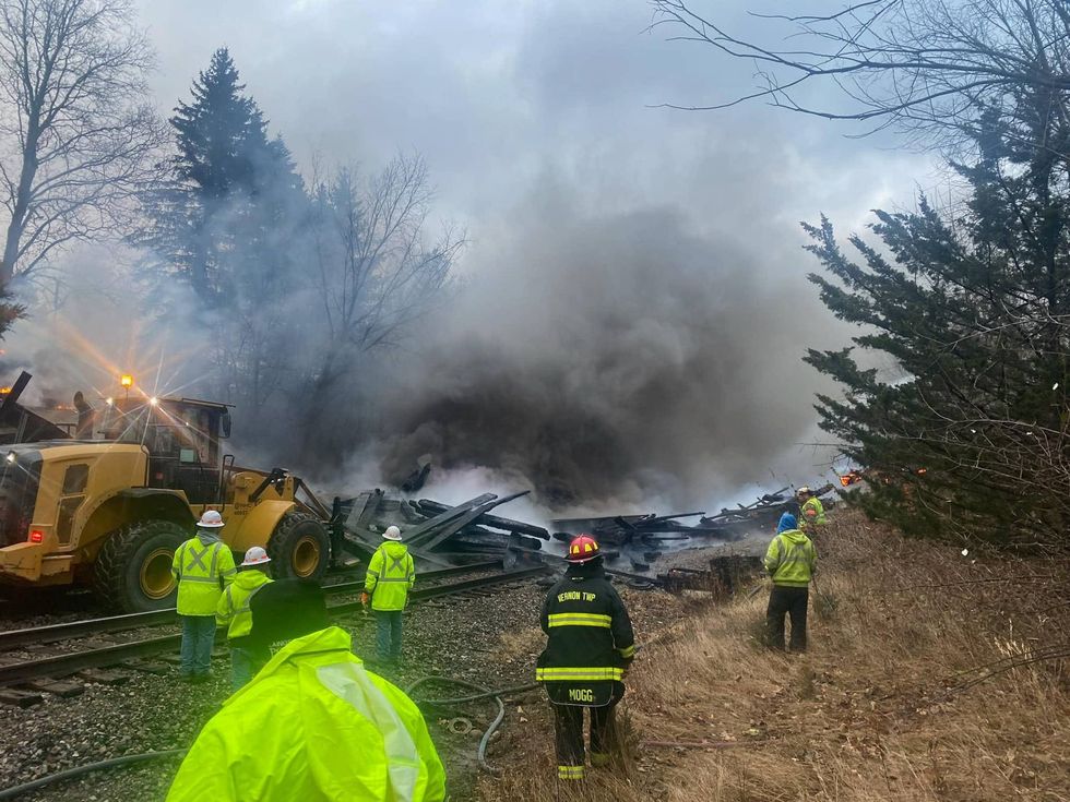 Authorities are investigating the cause of a raging fire that engulfed a wooden historic bridge in Mid Michigan and ultimately led to its collapse over the weekend