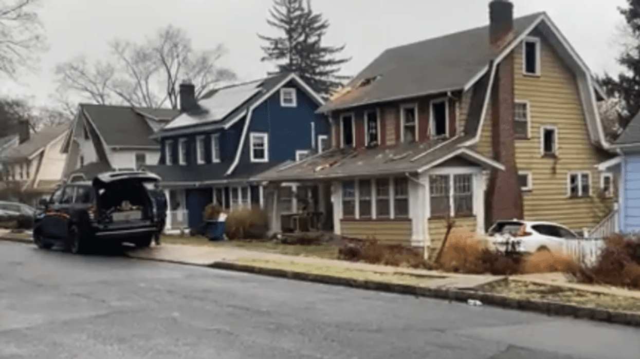 Authorities are investigating the link between a possible arson and the person found stabbed in the Maplewood home's basement.