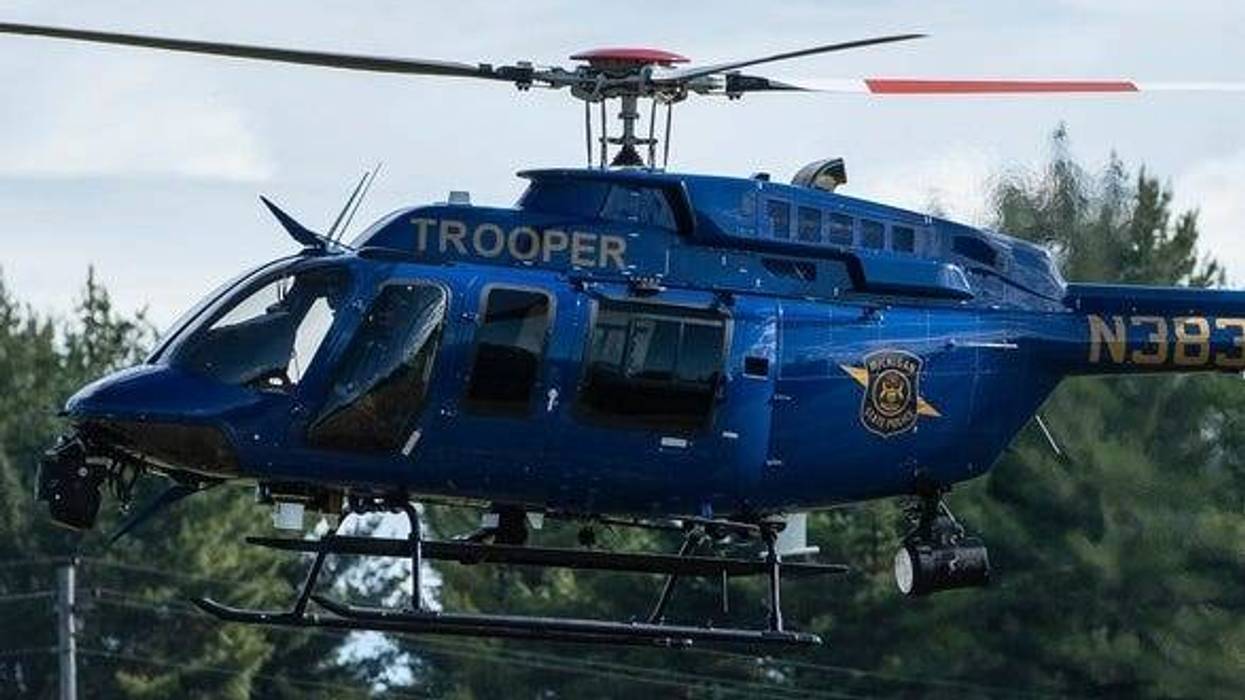 Authorities are trying to piece together why a suspect in a stolen vehicle was dressed like an officer and had discarded an illegal gun during a police chase in Detroit on Thursday morning.