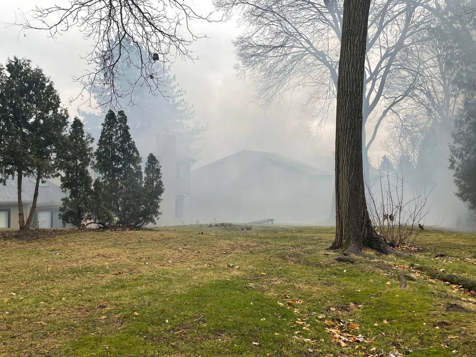 Authorities warned traffic will be slow moving along Woodward Ave. in Bloomfield Hills as crews work to control a fire that broke out at a condominium late Friday morning.