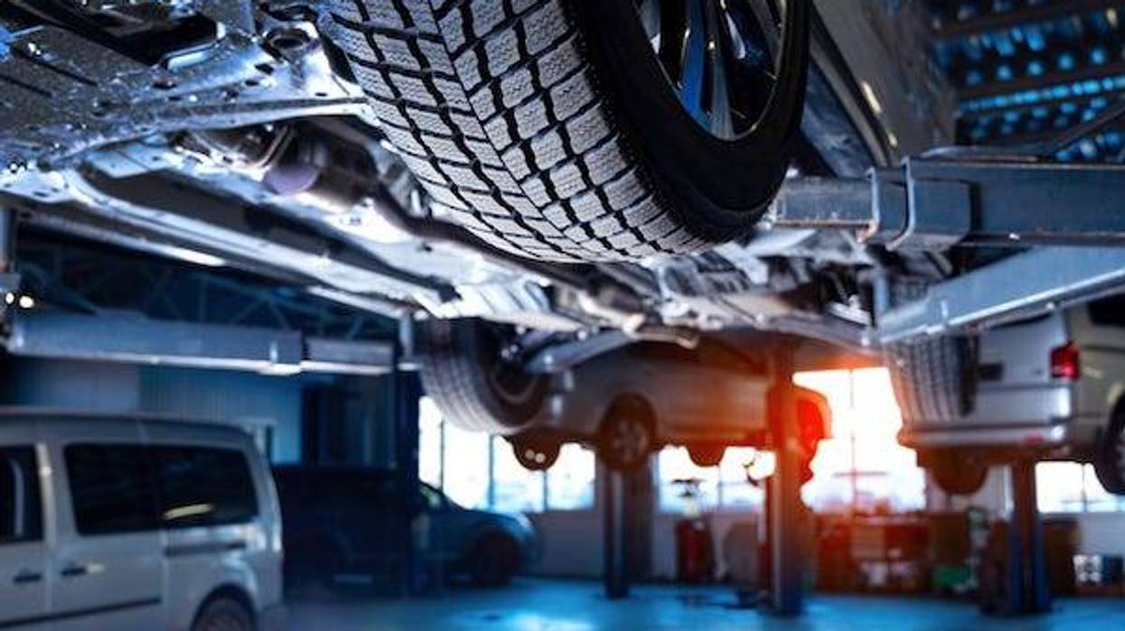 Auto service interior background with cars on the lift