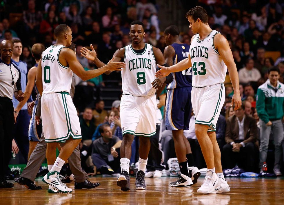 Avery Bradley #0, Jeff Green #8, and Kris Humphries #43 of the Boston Celtics congratulate each other in the first quarter against the Memphis Grizzlies during the game at TD Garden on November 27, 2013 in Boston, Massachusetts. NOTE TO USER: User expressly acknowledges and agrees that, by downloading and or using this photograph, User is consenting to the terms and conditions of the Getty Images License Agreement. (Photo by Jared Wickerham/Getty Images)