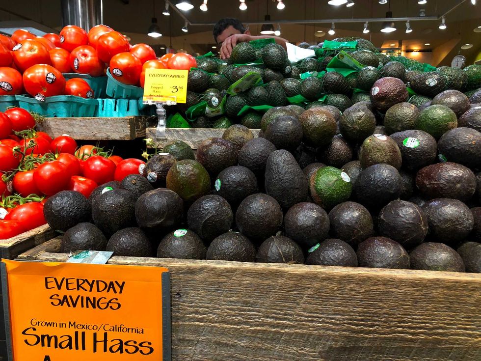 Avocados and tomatoes from Mexico are seen for sale in a store on June 6, 2019