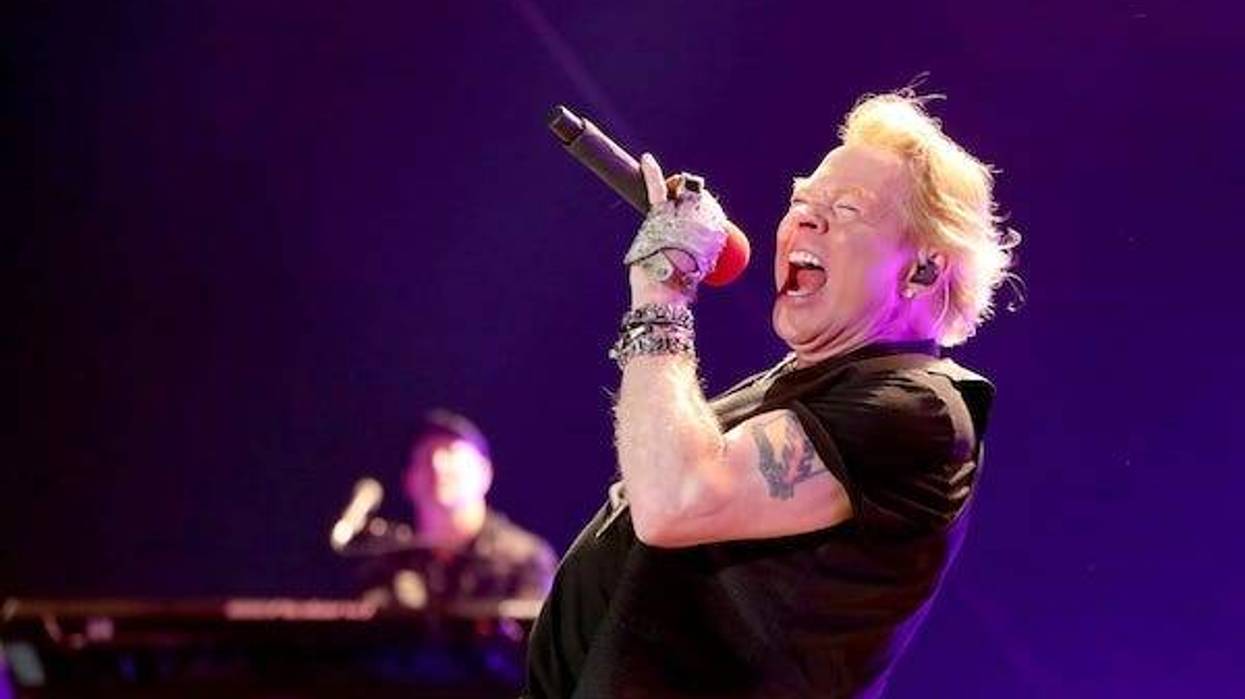 Axl Rose of Guns N' Roses performs with headliner Carrie Underwood at Stagecoach country music festival