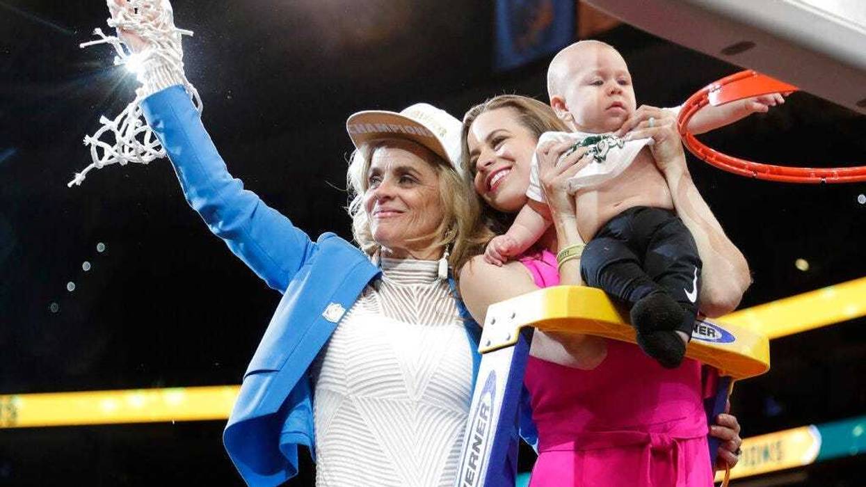 aylor coach Kim Mulkey, left, waves the net while standing with daughter and assistant coach Makenzie Fuller and Fuller's son, Kannon Reid Fuller, after the Final Four championship game of the NCAA women's college basketball tournament