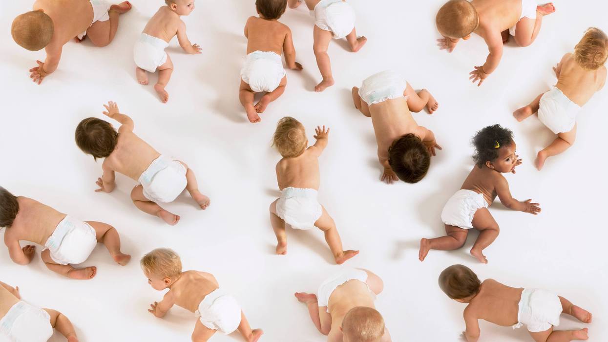 Babies crawling around on the floor