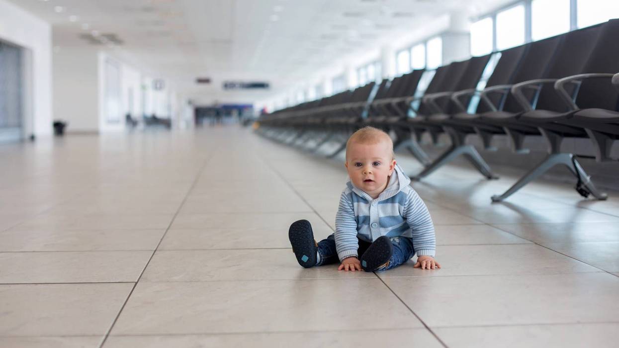 Baby alone at airport