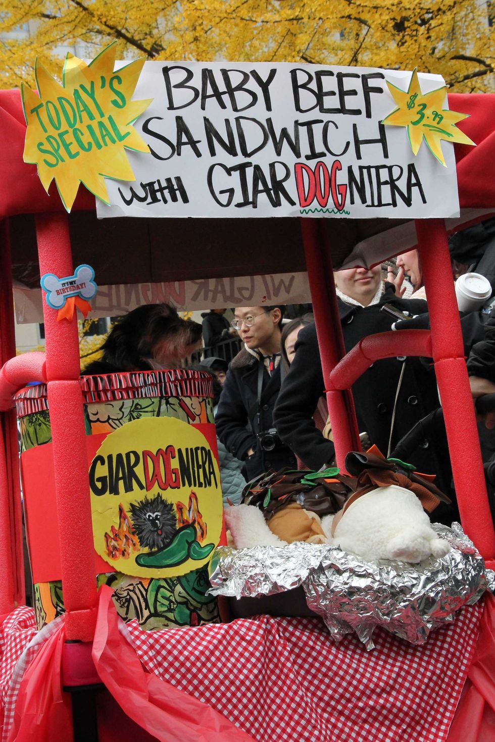 Baby beef costume includes a dog and a baby, dressed as a beef sandwich.