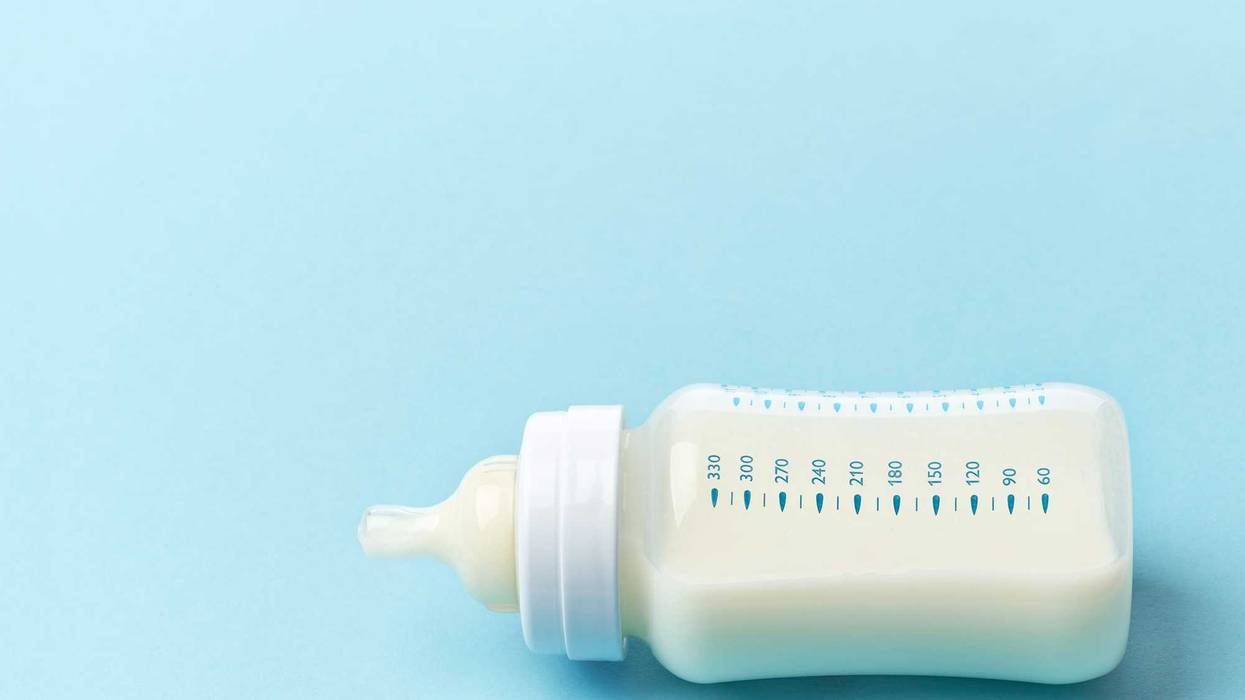 Baby bottle with milk in it.