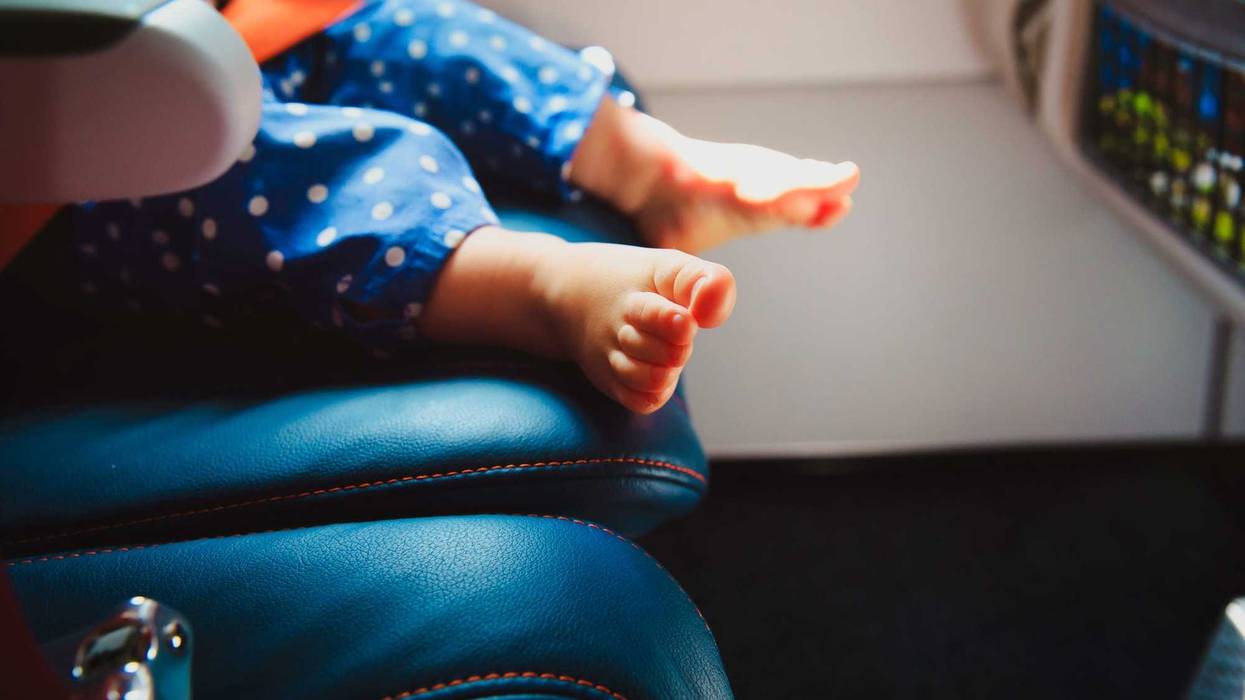 baby feet in airplane seat
