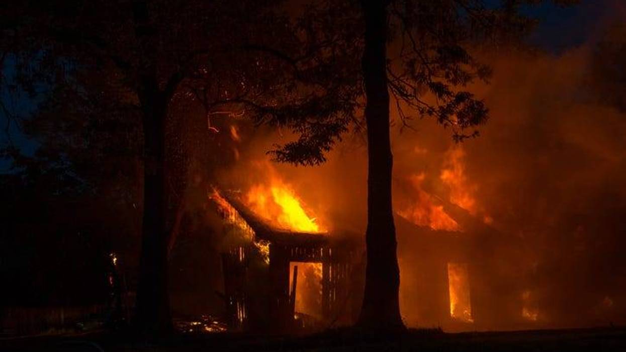 Background of a house fire in the forest.