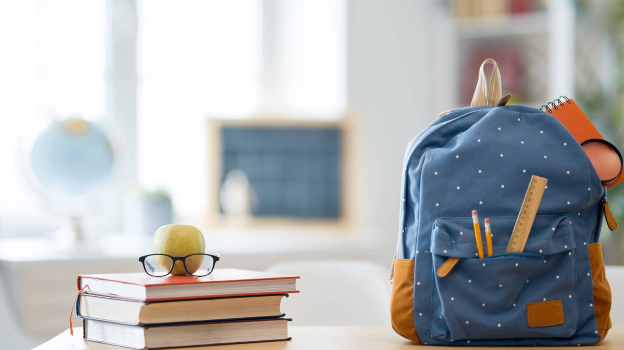 backpack and books on school desk