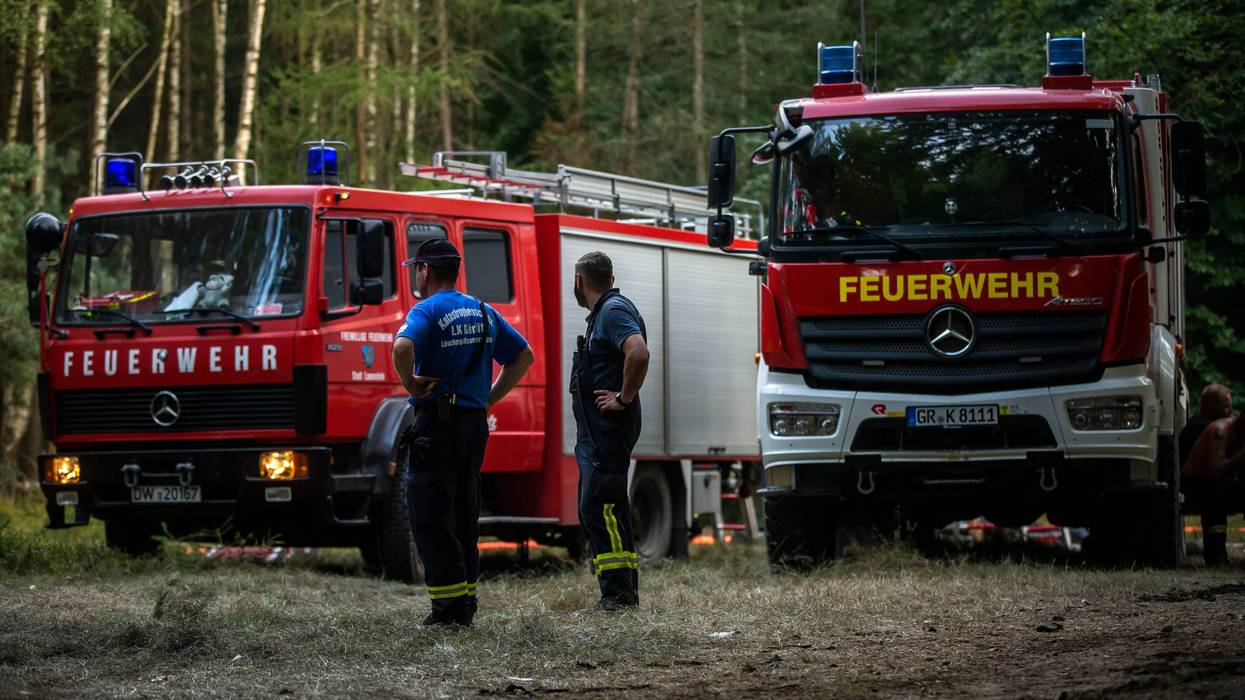 BAD SCHANDAU, Germany - AUGUST 02: Firefighters work during the operation in order to extinguish fires as it continues to burn in forests of Saxony Switzerland on August 02, 2022 near Bad Schandau, Saxony, Germany. The fire broke out on July 24th and started spreading as the wind rose, it has spread out in Bohemian Switzerland, National Park, Czech Republic as well as Saxony Switzerland in Germany.