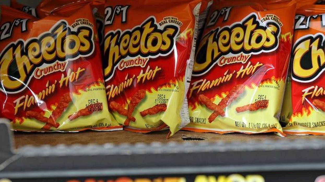 Bags of Flamin' Hot Cheetos on the shelf