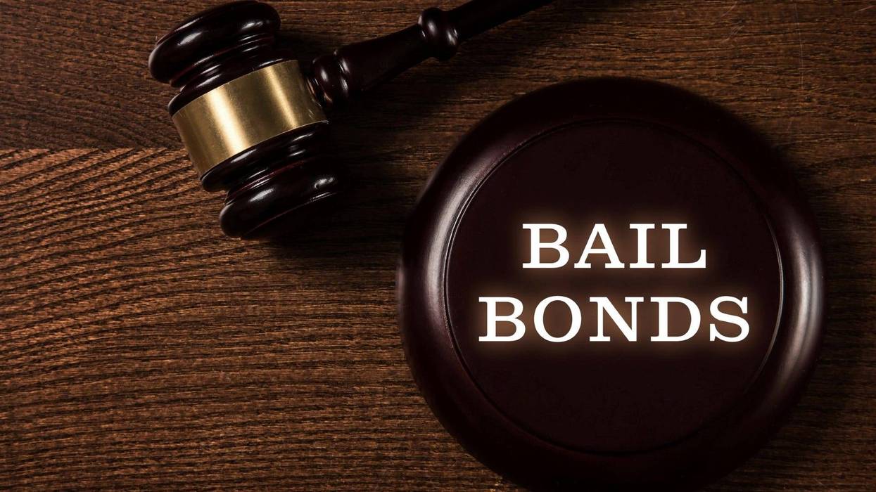 Bail bonds services concept. Judge gavel on wooden background.