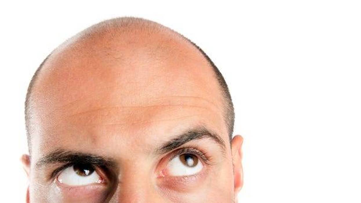 Bald man looking up