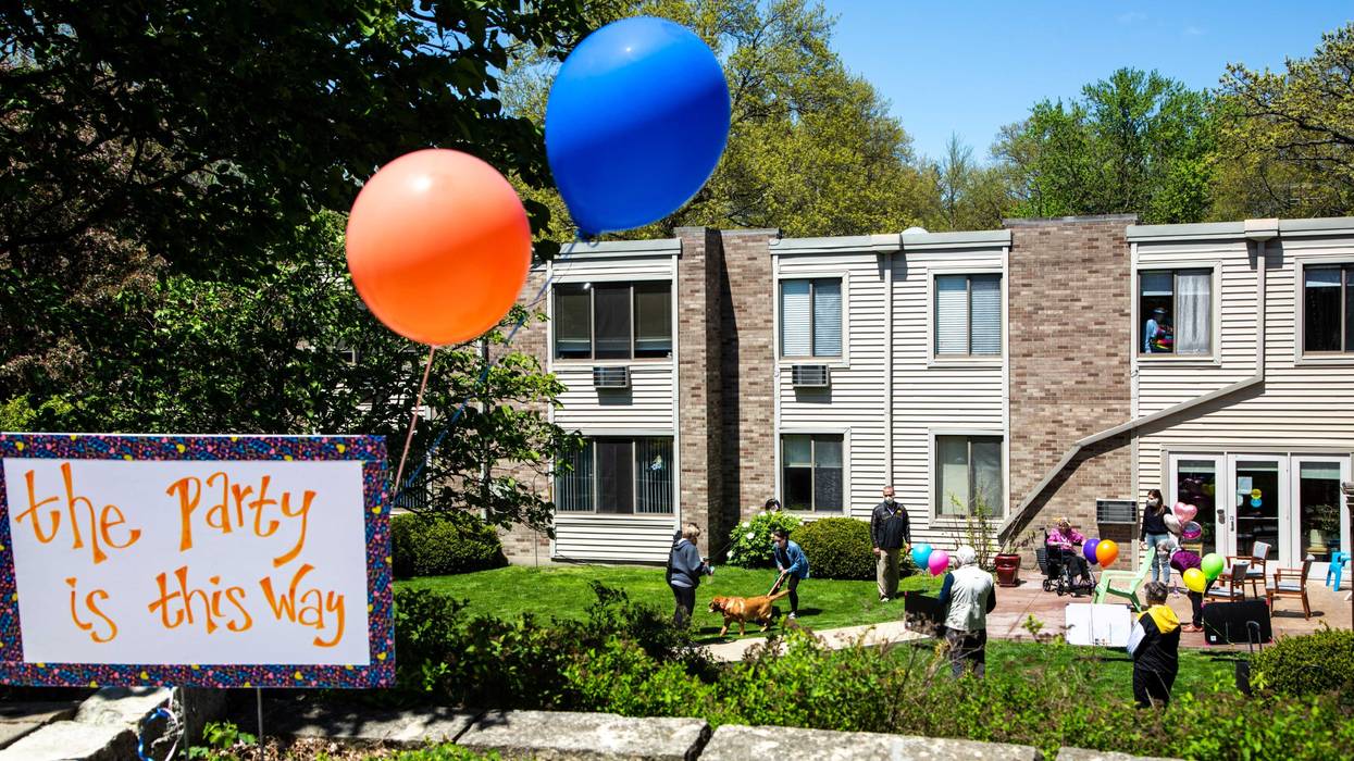 Balloons help direct people towards a party for Jeanne Kuentzel while she celebrates her 100th birthday with family members and Oaknoll staff, Friday, May 8, 2020, at Oaknoll Retirement Residence in Iowa City, Iowa. 200508 Birthday 100 001 Jpg