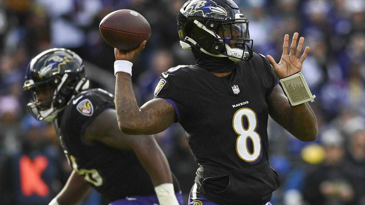 Baltimore Ravens quarterback Lamar Jackson (8) throws during the during the first quarter against the Miami Dolphins at M&T Bank Stadium.