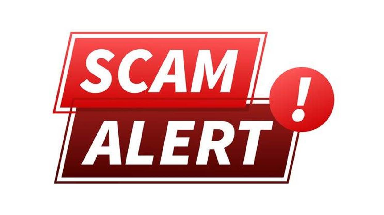 Banner with "scam alert" written in red. Attention sign