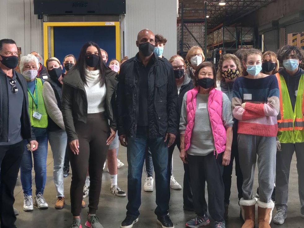 Barry Bonds poses with volunteers at the San Francisco-Marin Food Bank in San Rafael.