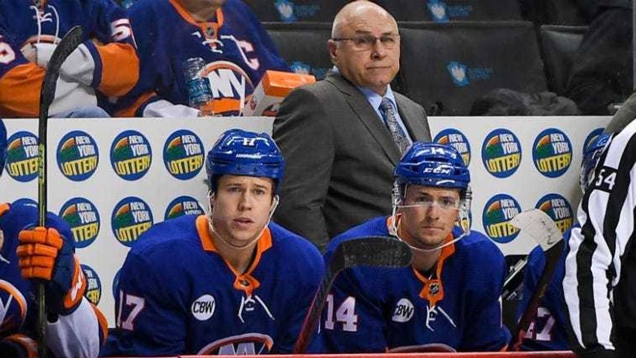 Barry Trotz looks on from behind the bench against the Washington Capitals during the third period at Barclays Center.