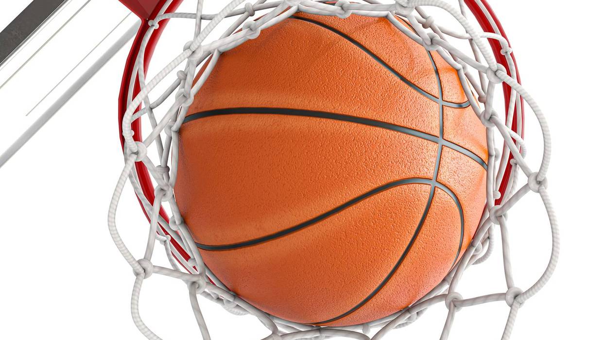 Basketball going through net showing scoring success