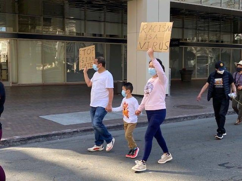 Bay Area residents gathered in Oakland to protest the recent violent attacks on Asian Americans.