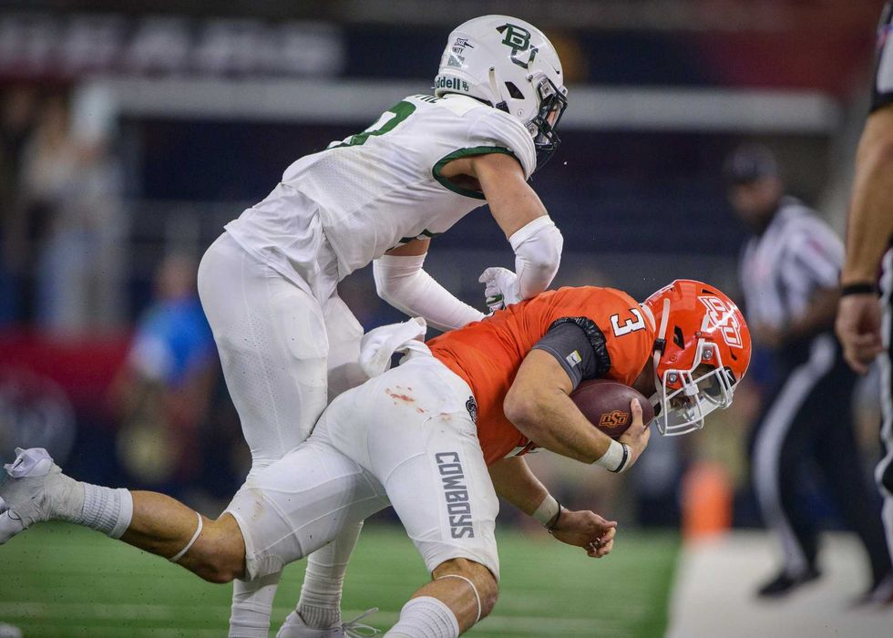 Baylor Bears safety Jalen Pitre (8) hits Oklahoma State Cowboys quarterback Spencer Sanders (3) during the second half in the Big 12 Conference championship game at AT&T Stadium.