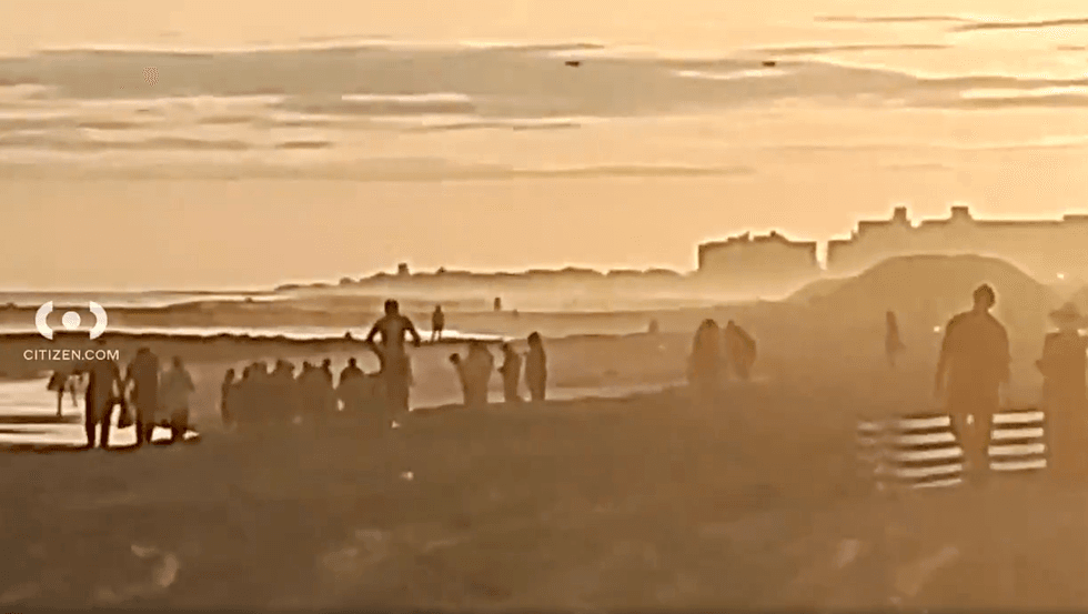 Beachgoers watched the rescue unfold around 6 p.m. Thursday